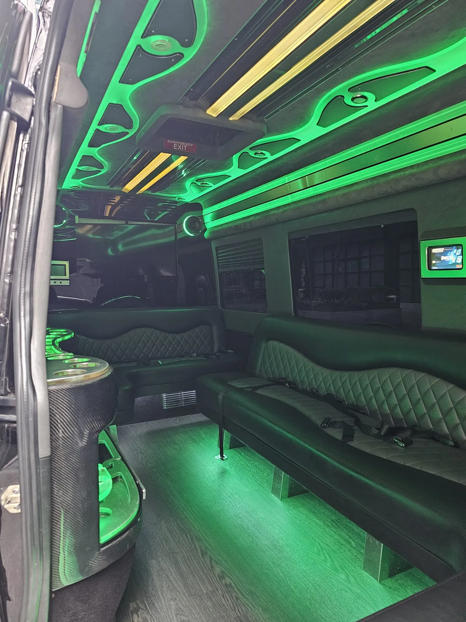 Limo Sprinter interior with perimeter lounge seating and ambient lighting