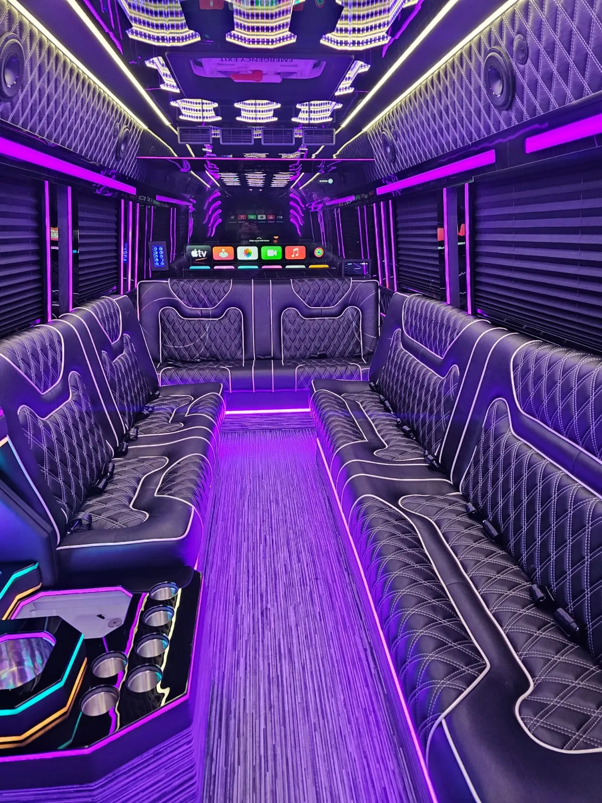 Limo Sprinter interior with perimeter lounge seating and ambient lighting