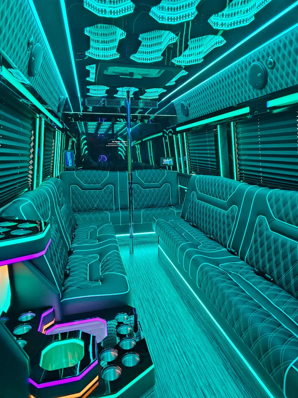 Limo Sprinter interior with perimeter lounge seating and ambient lighting
